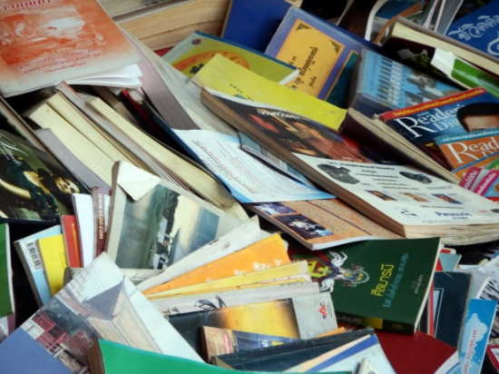 Pile of old books ready to be thrown out during moving house in Tamworth