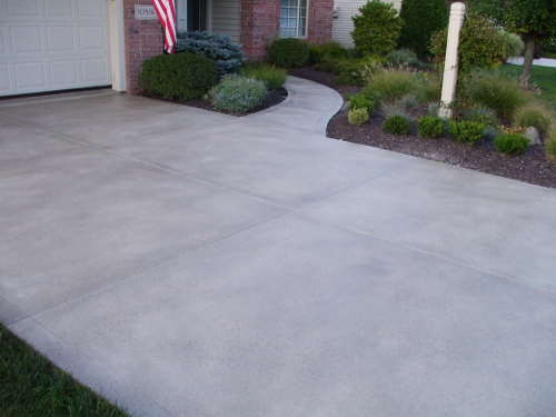 A completed job of a concrete driveway resurfacing on a Wollongong driveway.